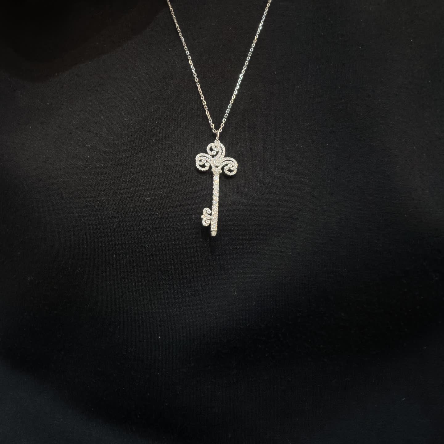 Tiffany & Co Elegant Silver Key Pendant with Diamonds